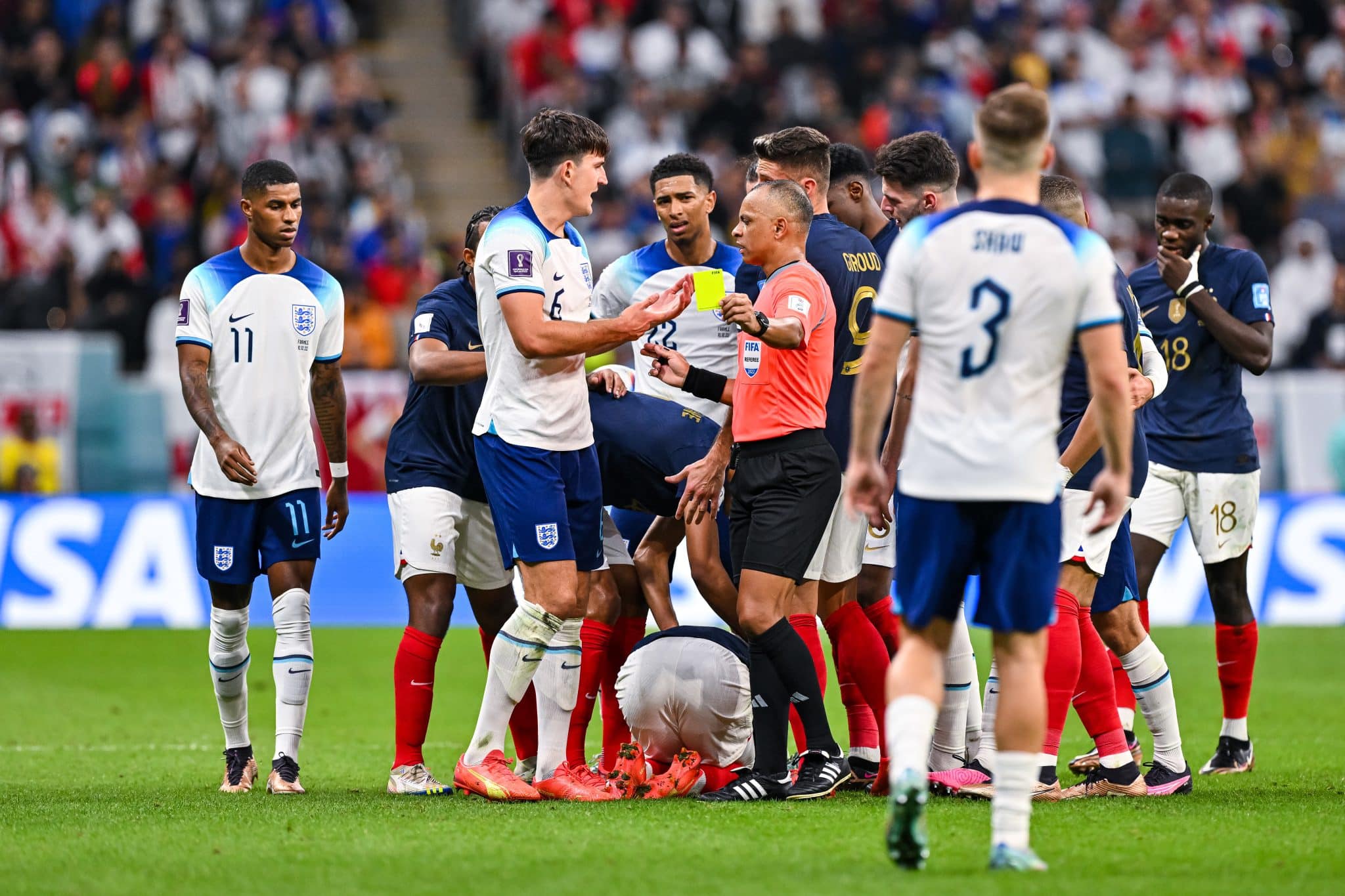 England defender Maguire debates with referee in the quarter-final versus France